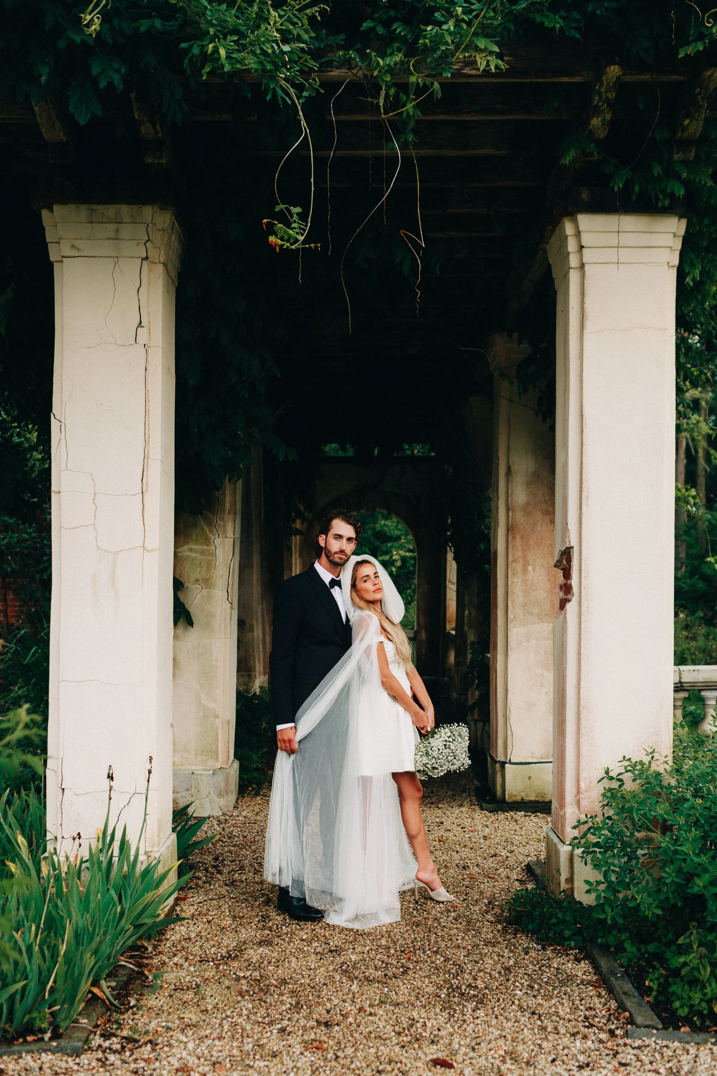wedding couple in the formal gardens at bard college during their elopement in the hudson valley