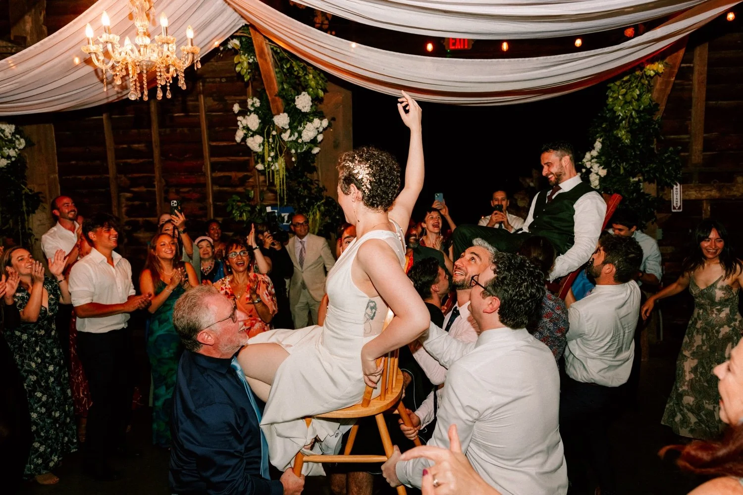 photographs of the hora during hudson valley wedding at crested hen farms