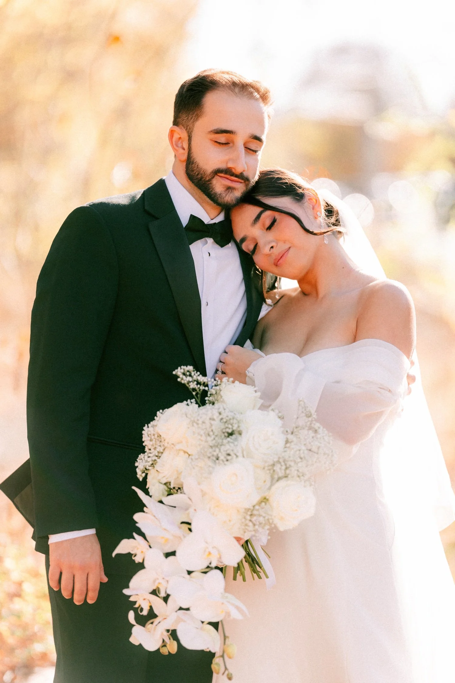 timeless photograph of wedding couple cuddling at the roundhouse