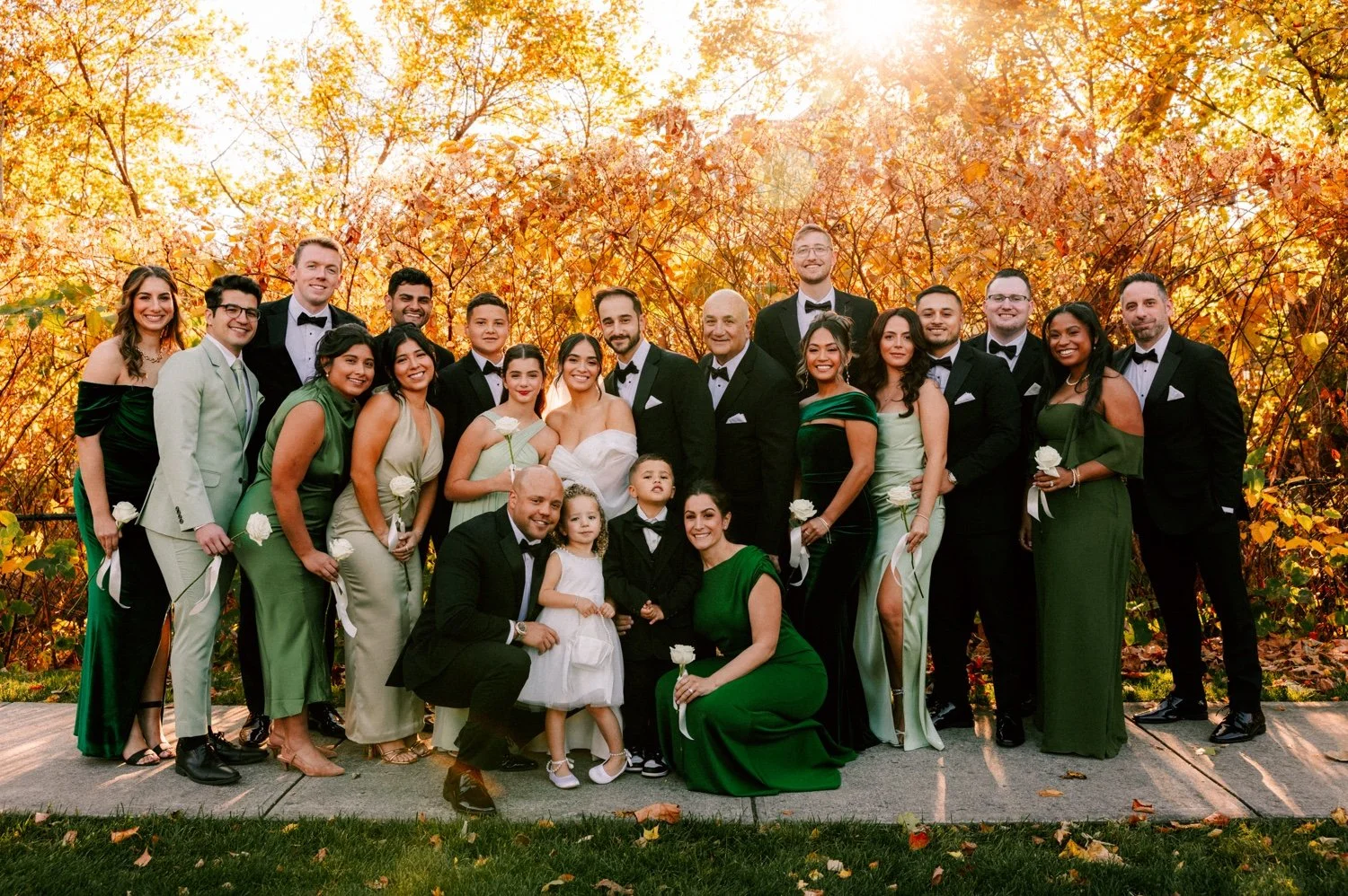 wedding party grouped together at autumn wedding at the roundhouse