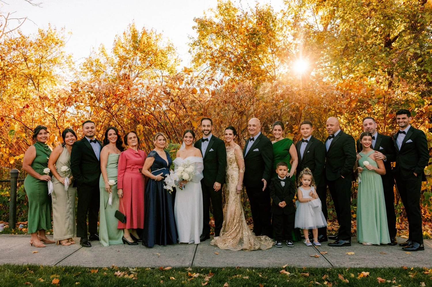 timeless photograph of bride and groom’s family during autumn wedding at the roundhouse