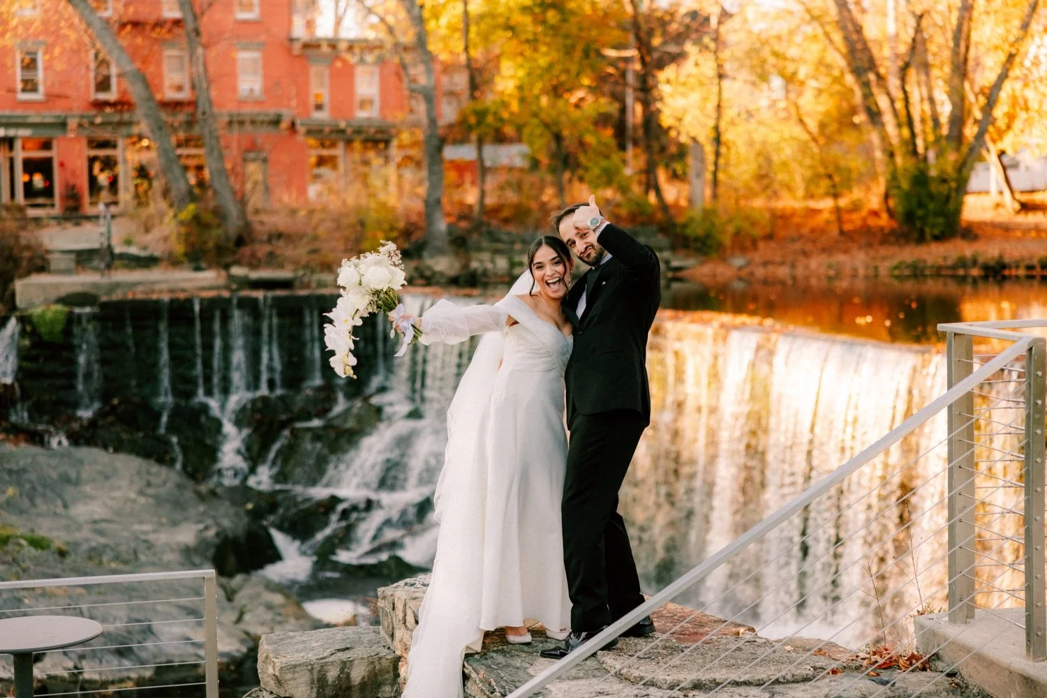 bride and groom celebrate in front of beacons falls during their autumn wedding day at the roundhouse