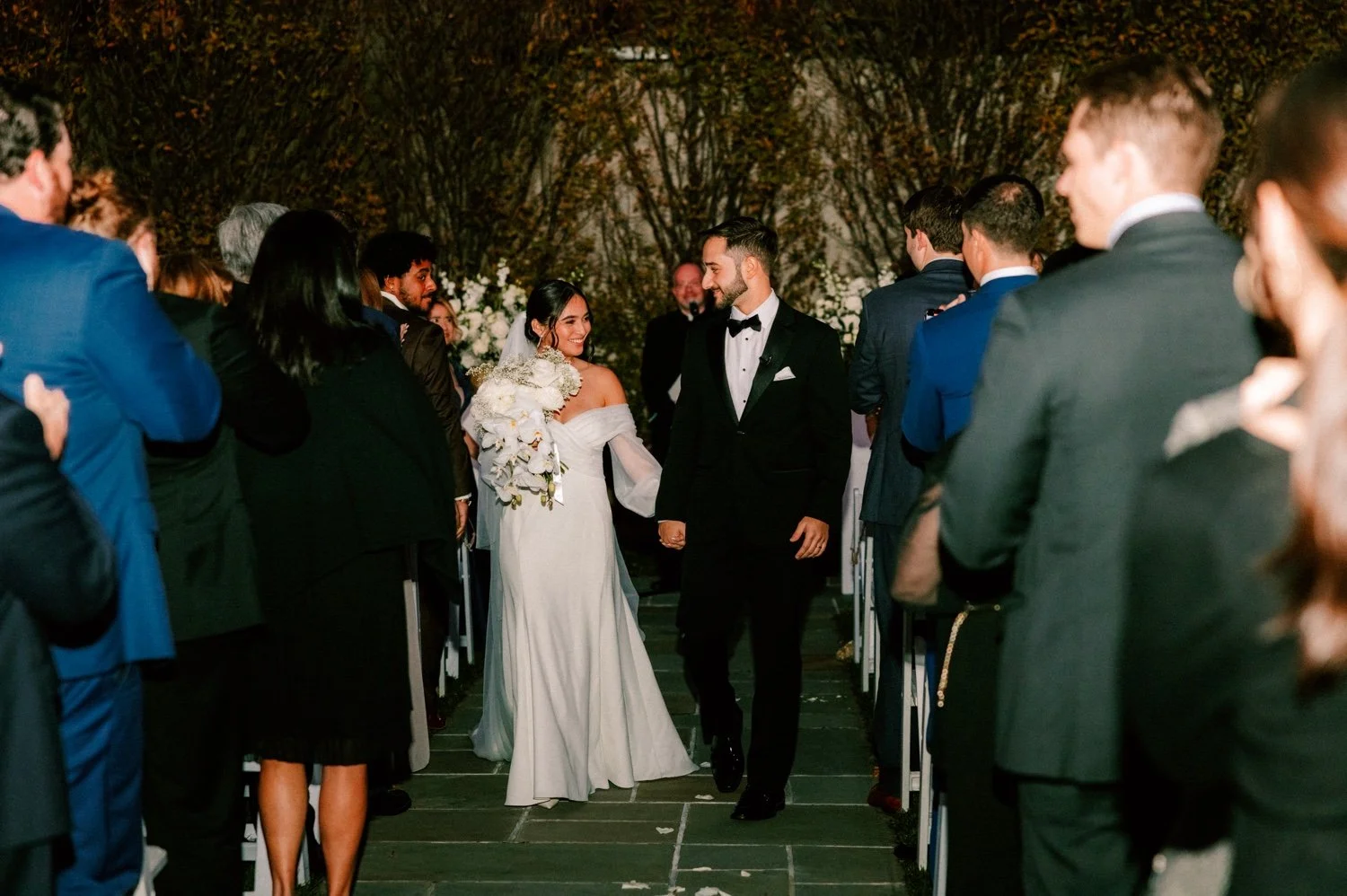 bride and groom just married in the dark outside the roundhouse