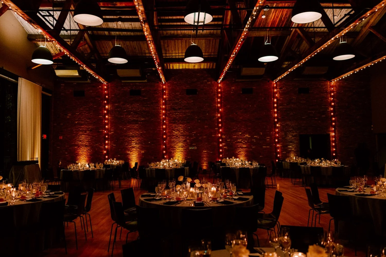 wedding reception decor by mira mira florals and lighting by lnj tech at the roundhouse