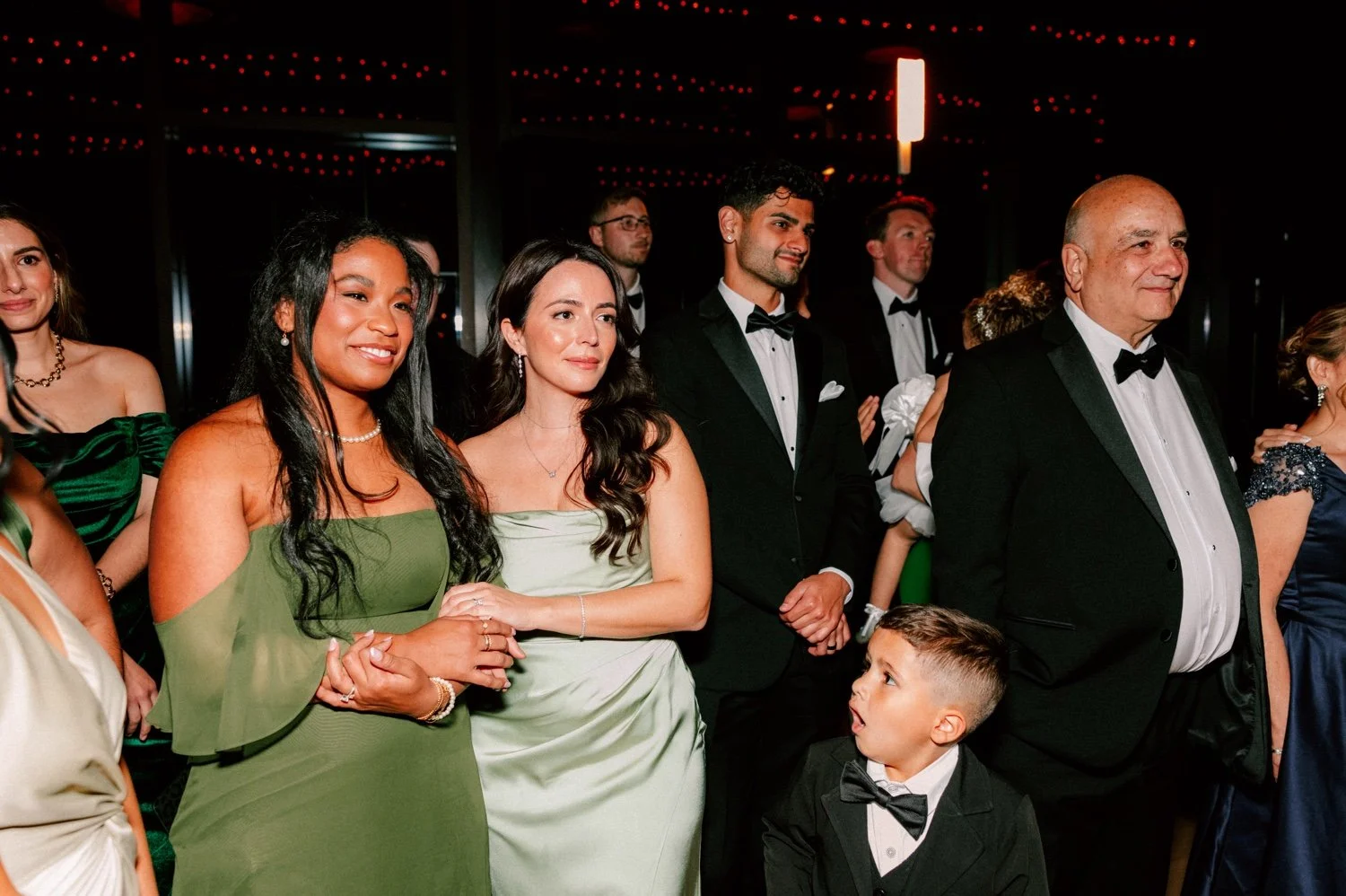 friends watch bride dance with her mother and brother at the roundhouse
