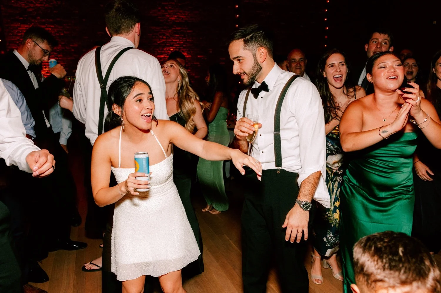 bride and groom have fun during reception at the roundhouse