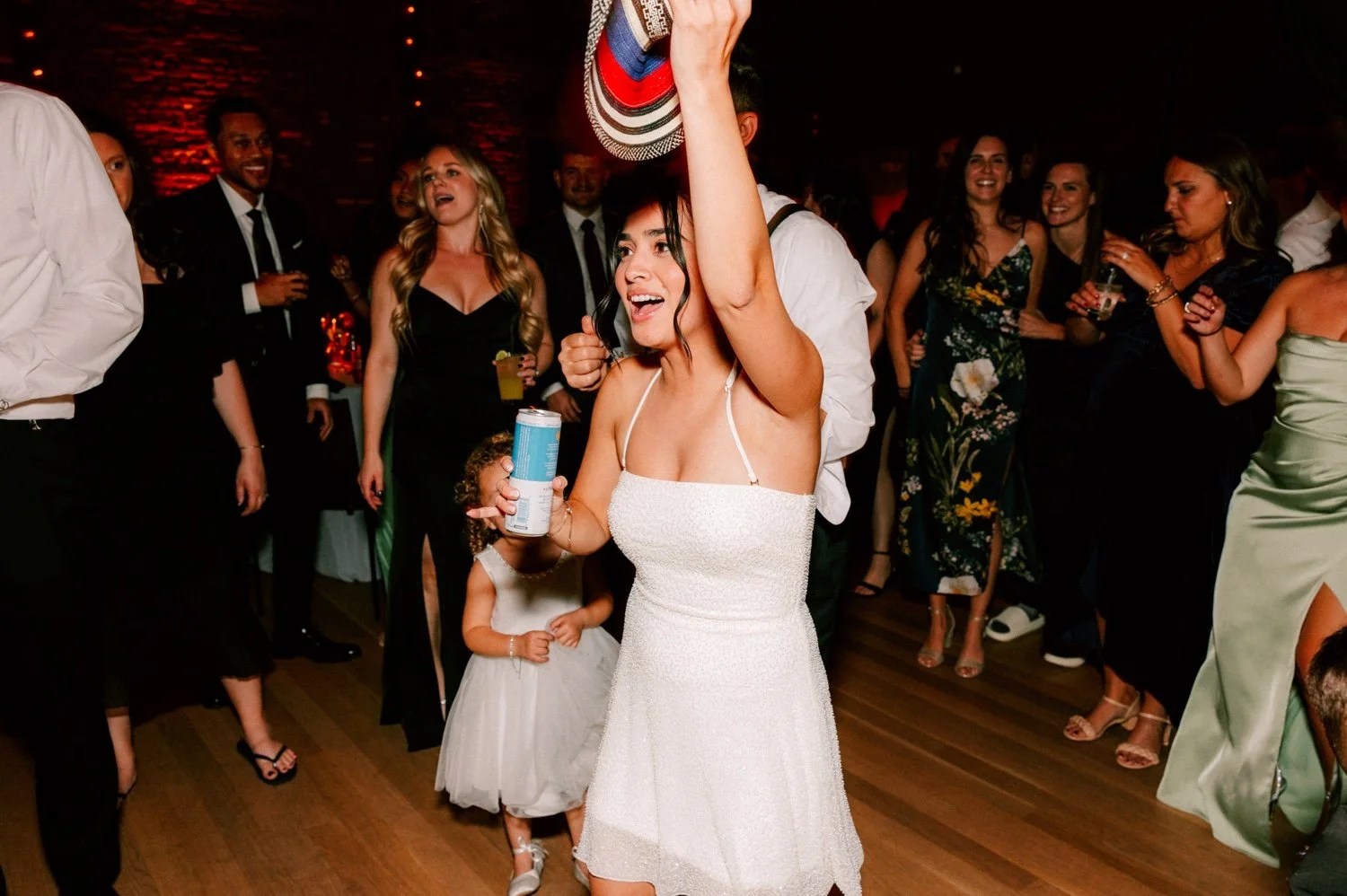 bride passes cowboy hat at the roundhouse