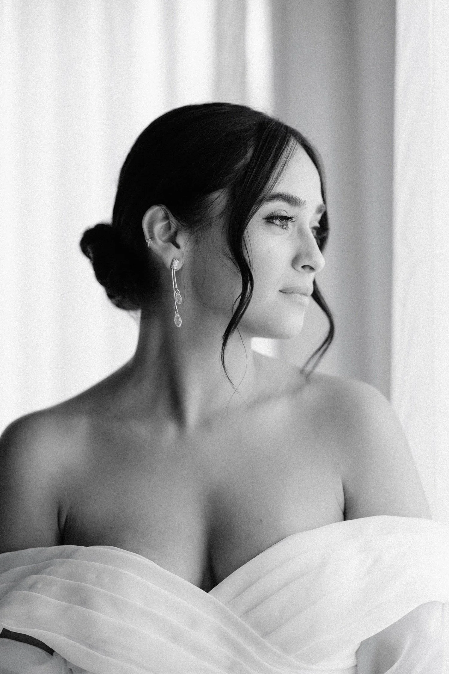 timeless black and white photograph of bride getting ready in the penthouse on her wedding day at the roundhouse