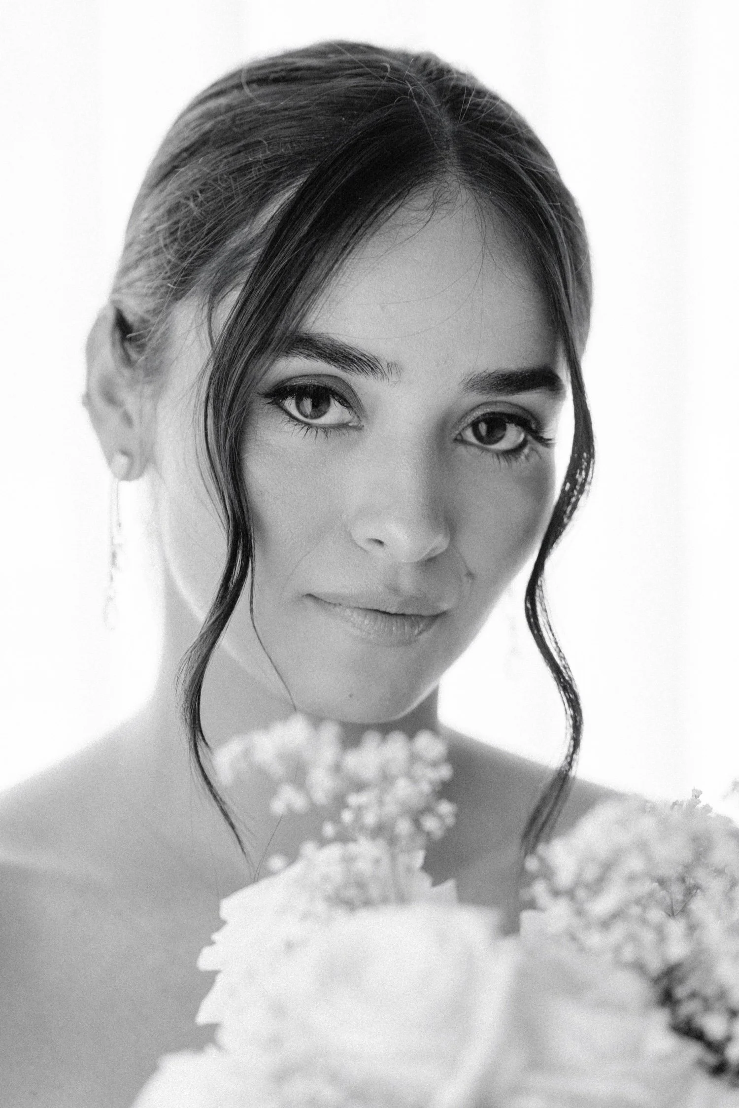 black and white editorial portrait of bride in penthouse on her wedding day at the roundhouse