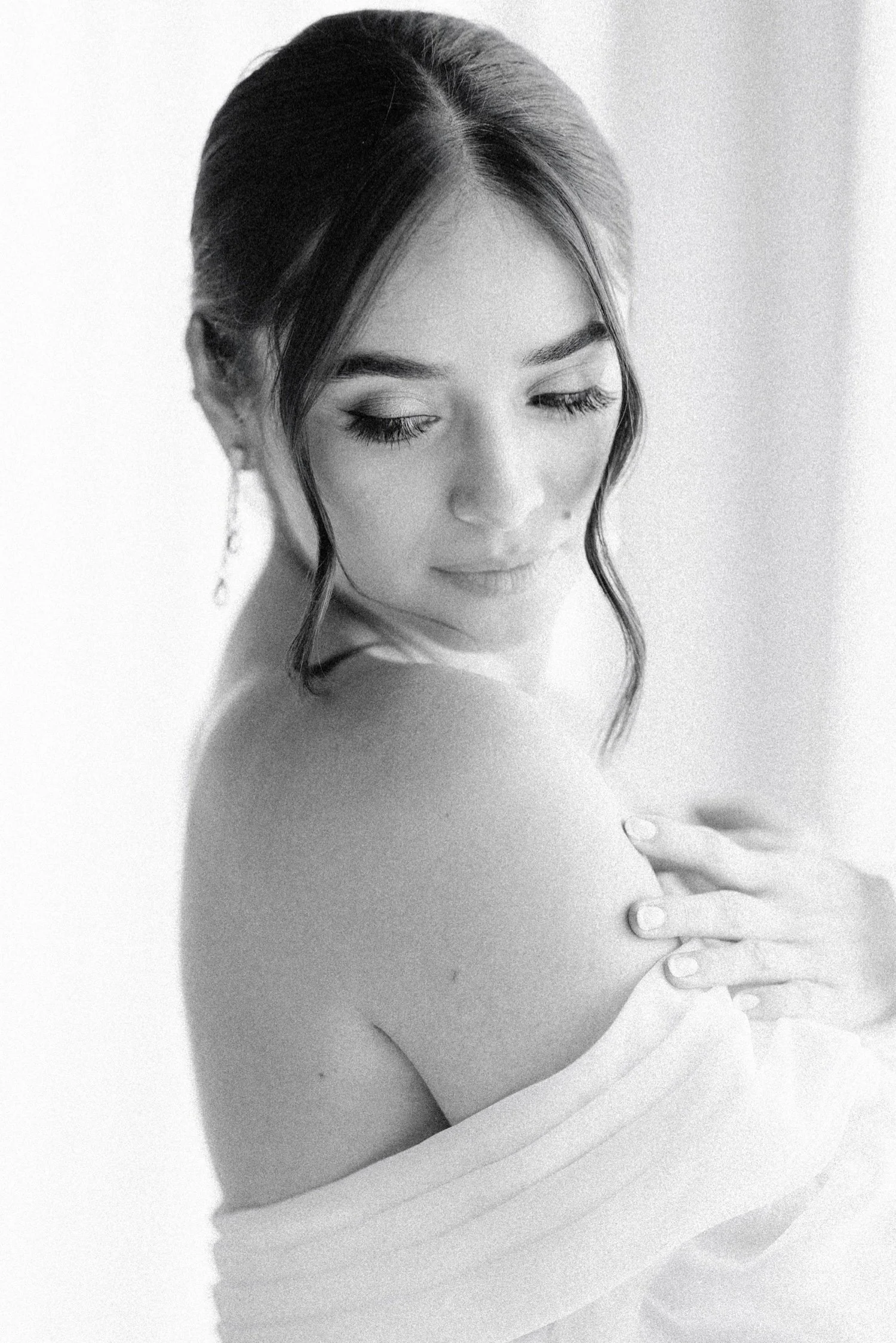 black and white editorial photograph of bride in the penthouse on her wedding day at the roundhouse