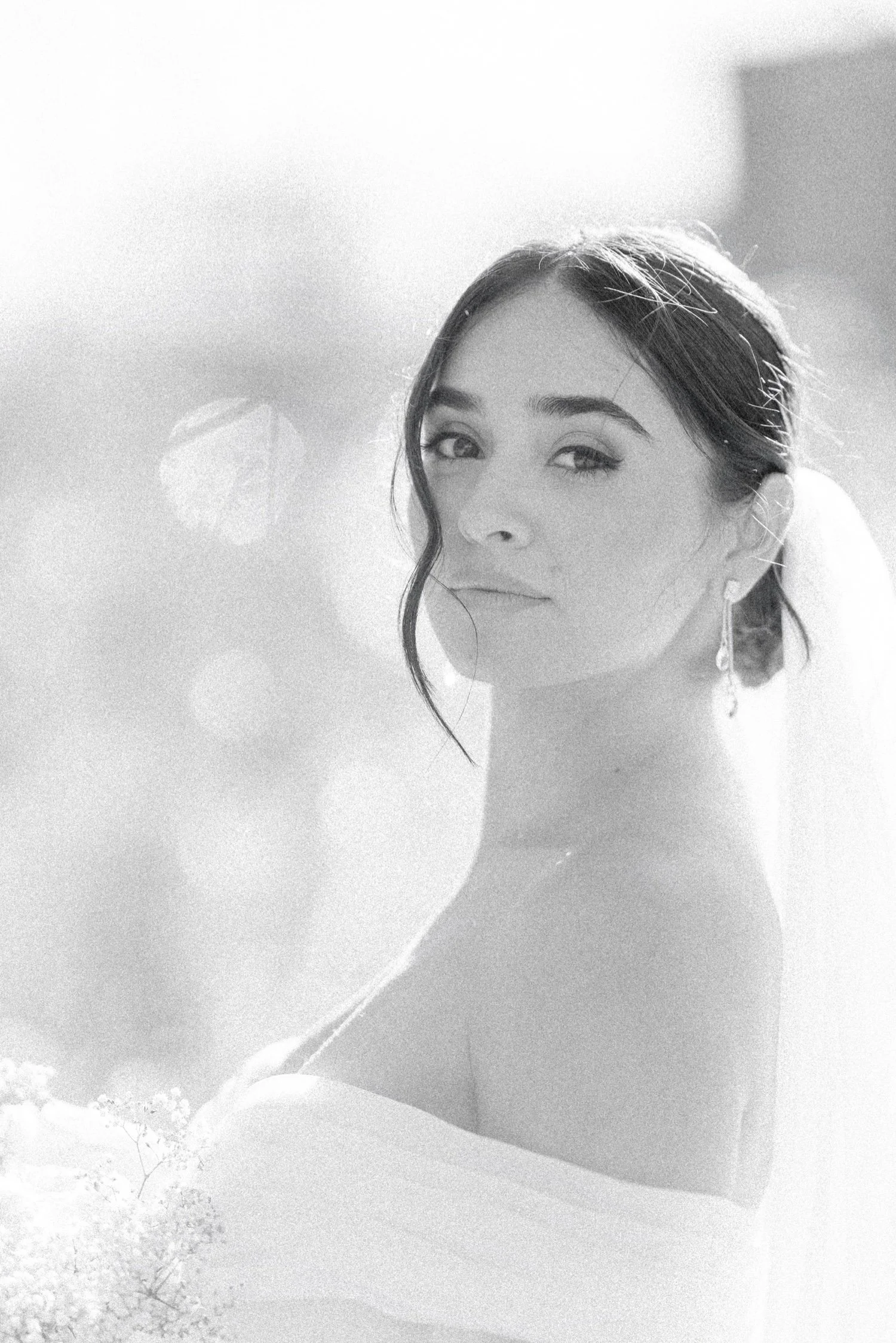 timeless black and white photograph of bride looking into the camera on her wedding day at the roundhouse