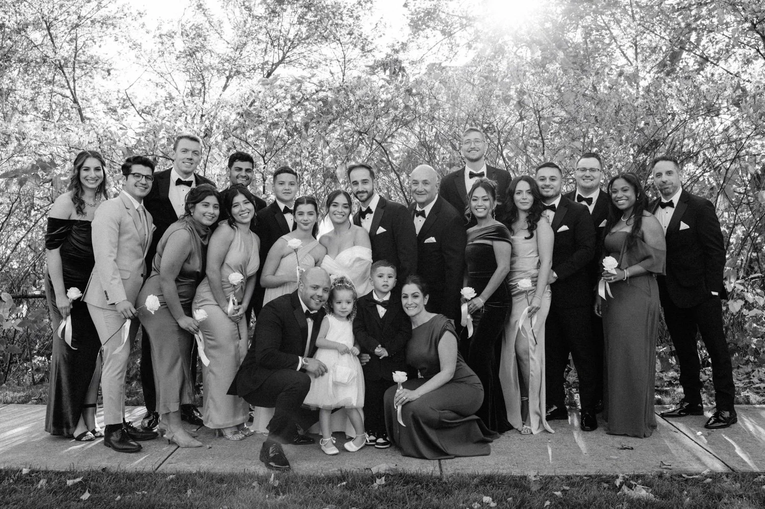 black and white photograph of wedding party on autumn day at the roundhouse