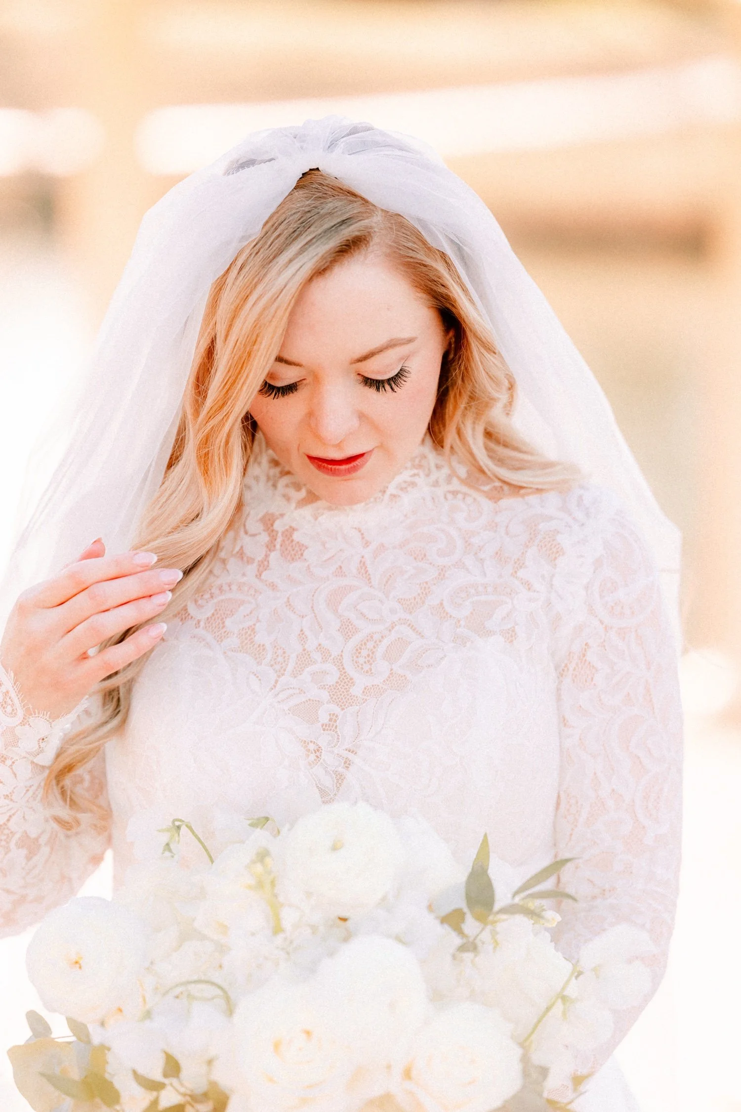 editorial wedding photograph of bride moving her hair outside in the winter at the ashford estate