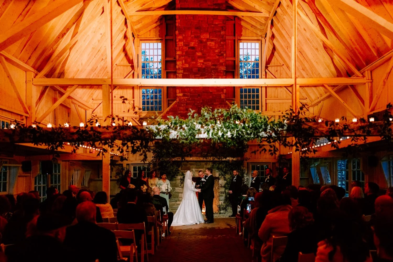 winter wedding ceremony in the barn at the ashford estate