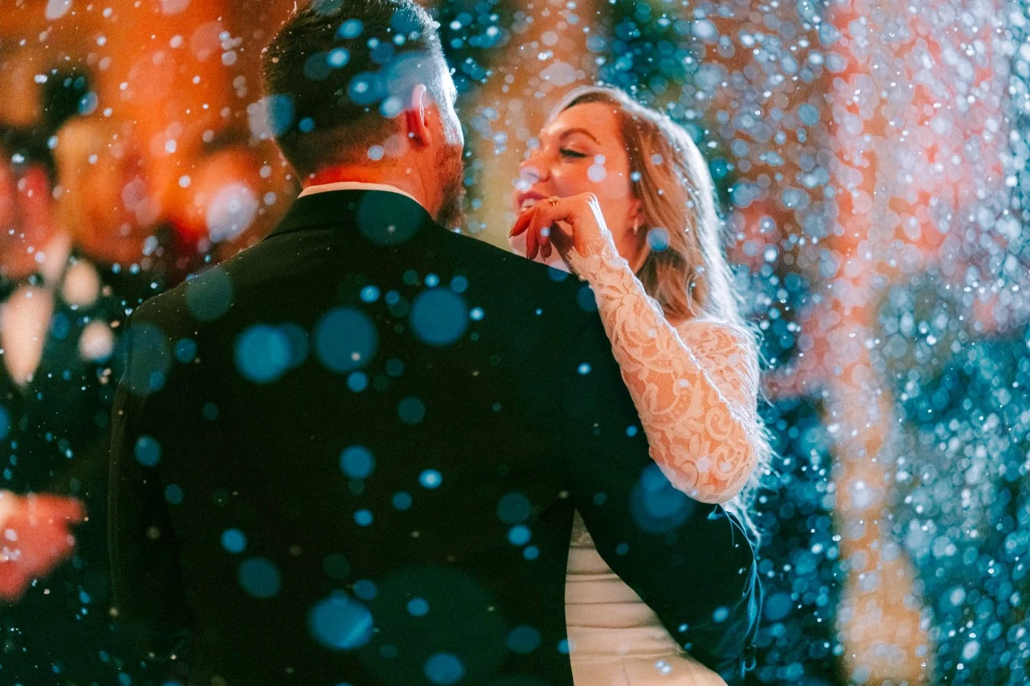 wedding couple share first dance at the ashford estate with fake snow