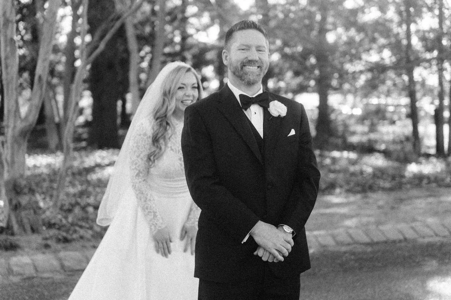 black and white photographs of wedding couple during their first look at the ashford estate