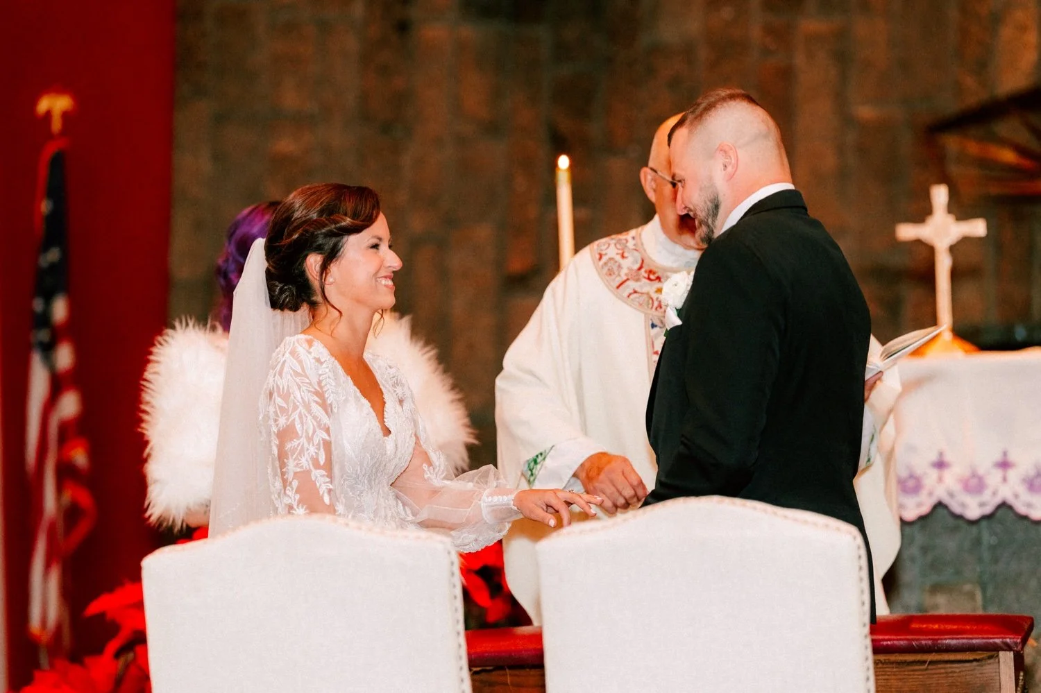  wedding couple hold hands during church ceremony in Newburgh, NY 