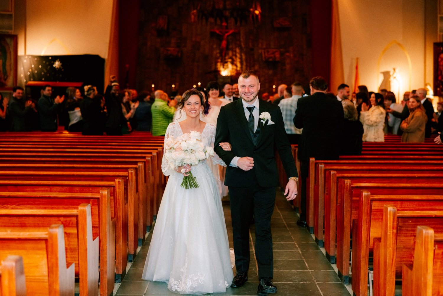  couple walk down the aisle during their wedding ceremony recessional in Newburgh ny 
