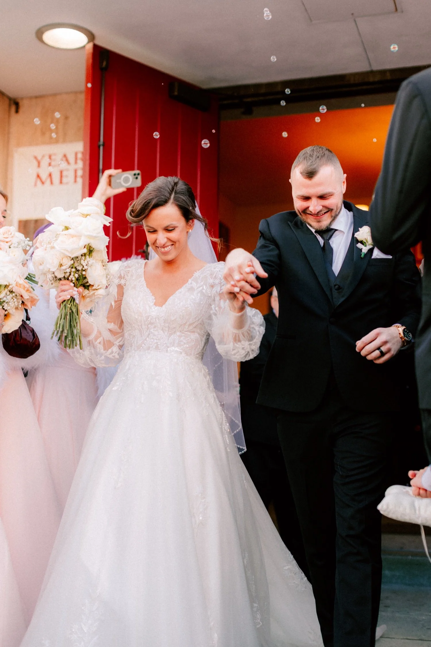  wedding couple walk through bubbles during their church exit in newburgh ny 