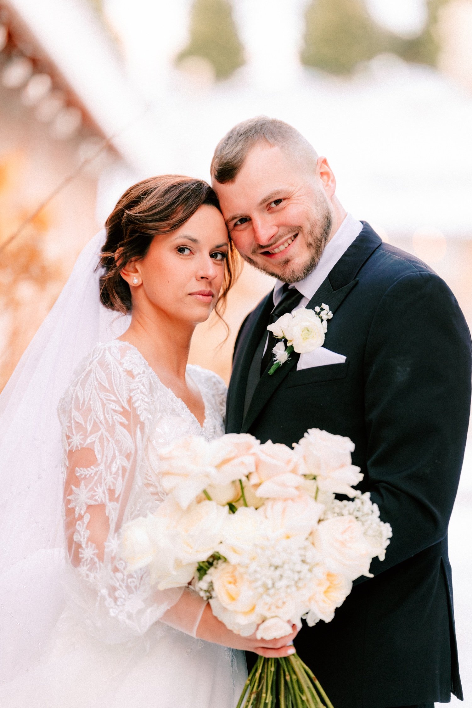 winter wedding couple posing outside in the snow at city winery hudson valley  