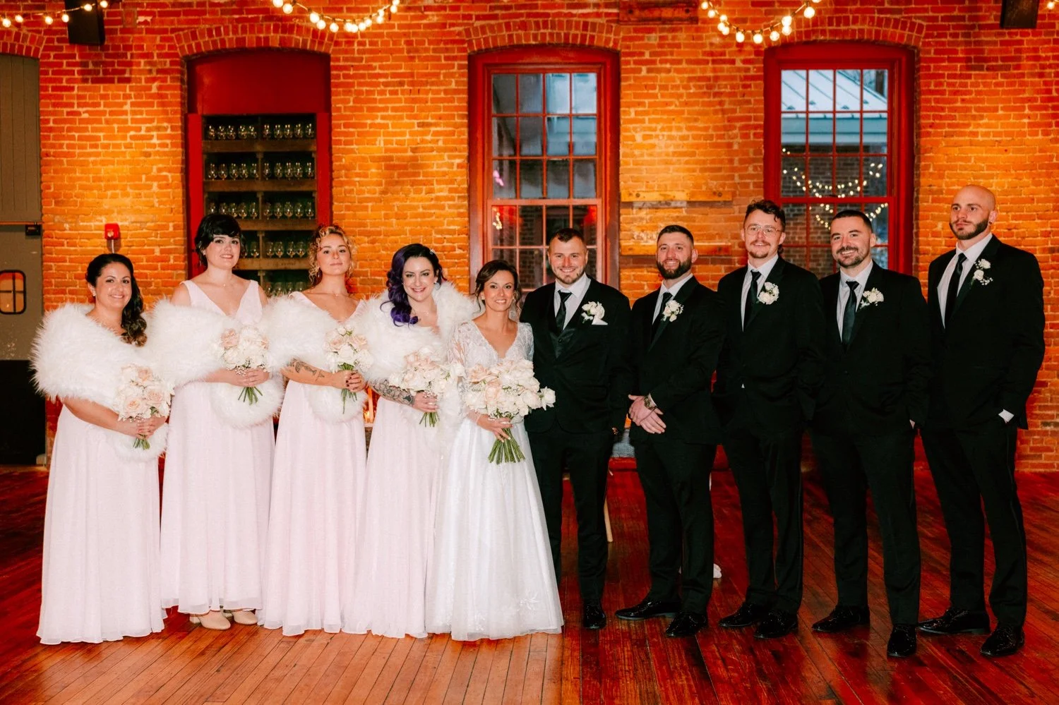  bridal party photos taken inside city winery hudson valley on winter wedding day 