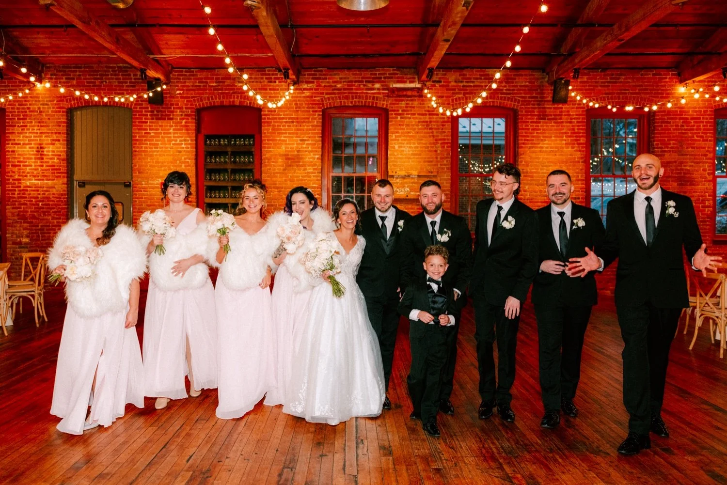  bridal party photos taken inside city winery hudson valley on winter wedding day 