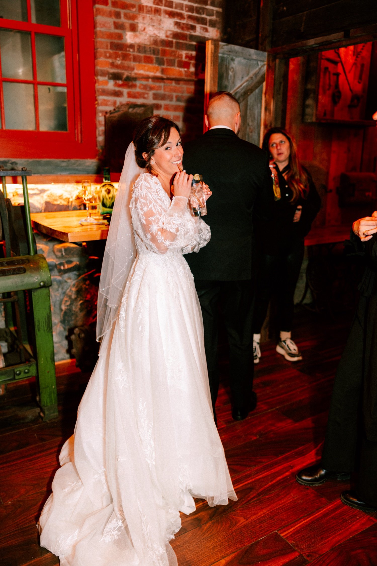  bride takes a sip of her signature cocktail at city winery hudson valley 