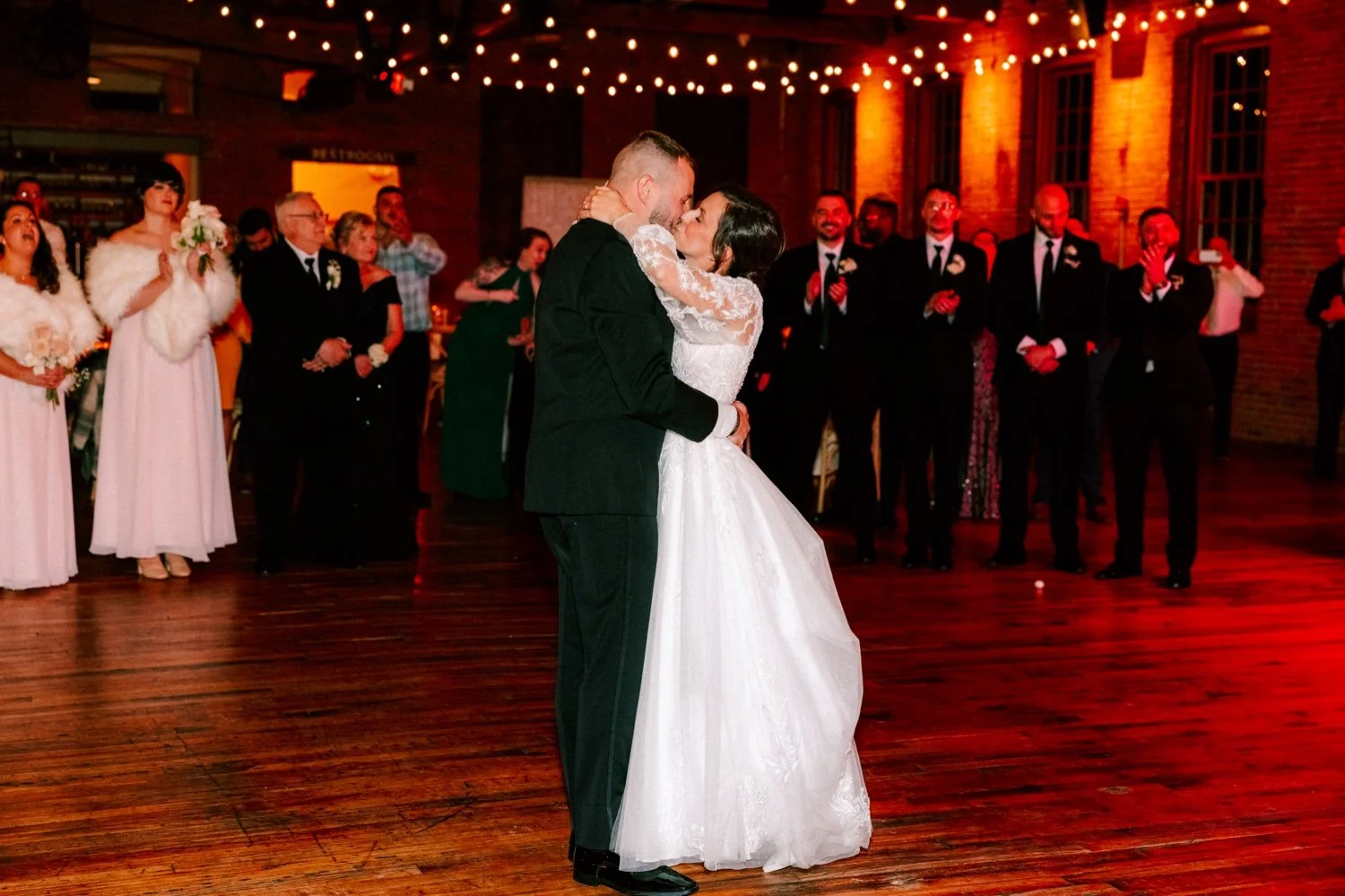  wedding couple share kiss during their first dance at city winery hudson valley 