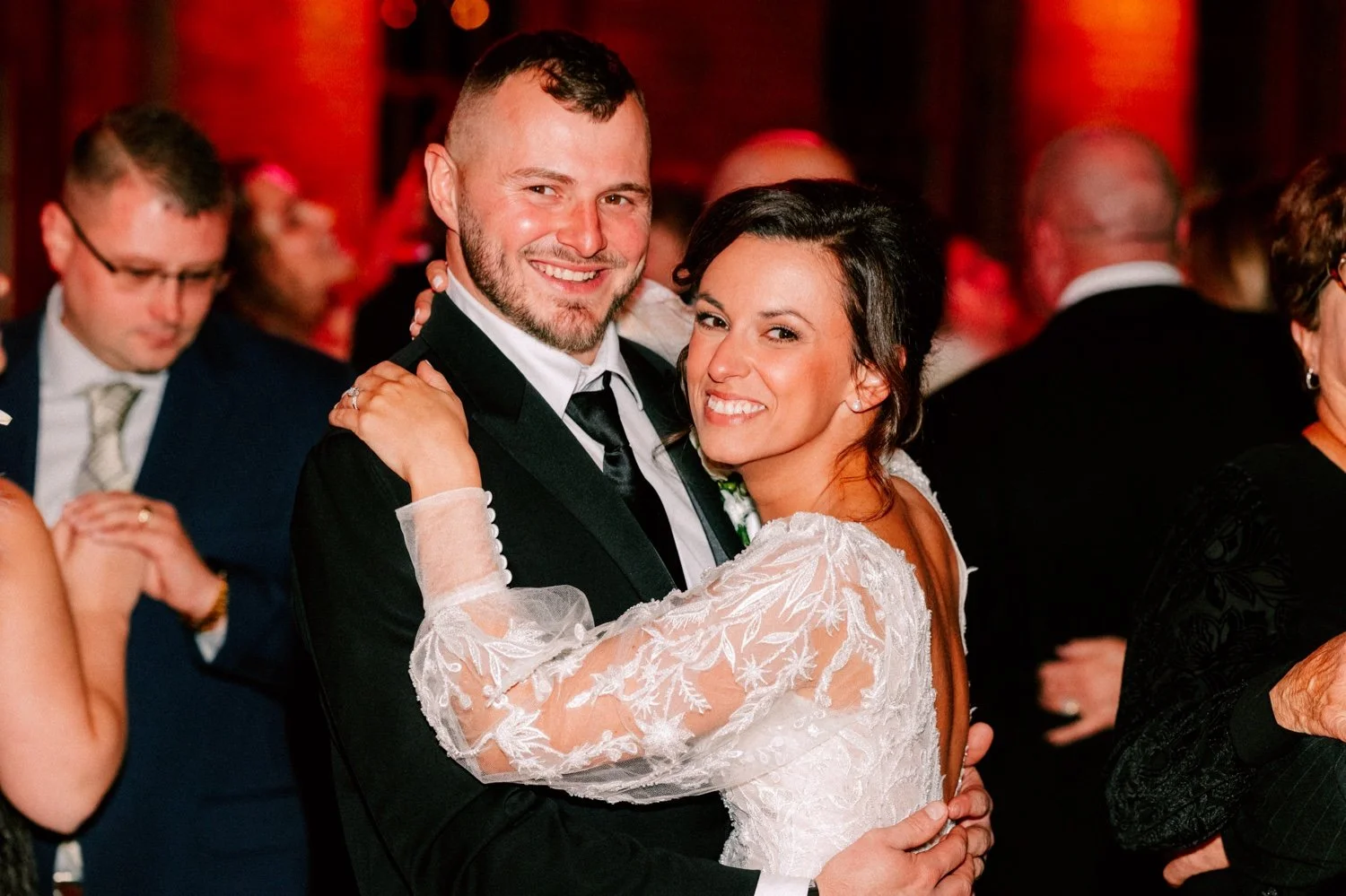  bride and groom smile for camera during their winter wedding reception at city winery hudson valley 
