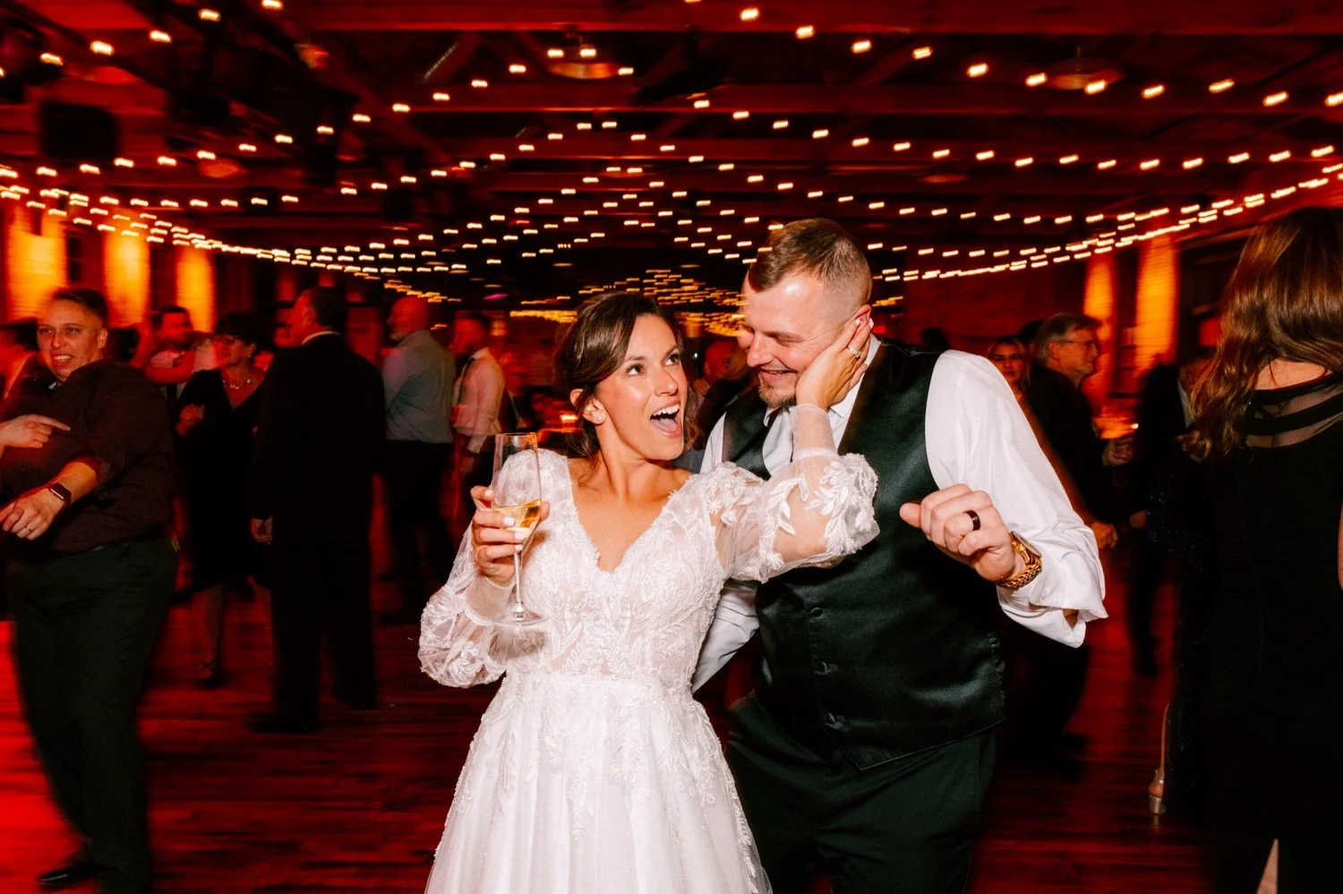 bride holds grooms face on the dance floor at city winery hudson valley 
