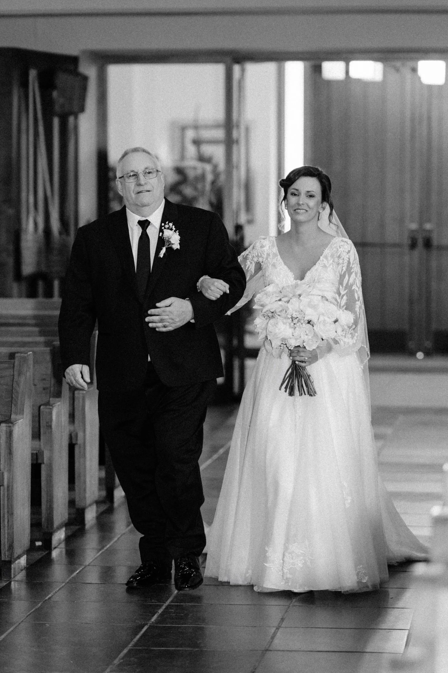  bride walking down the church aisle for her wedding ceremony in newburgh, ny 