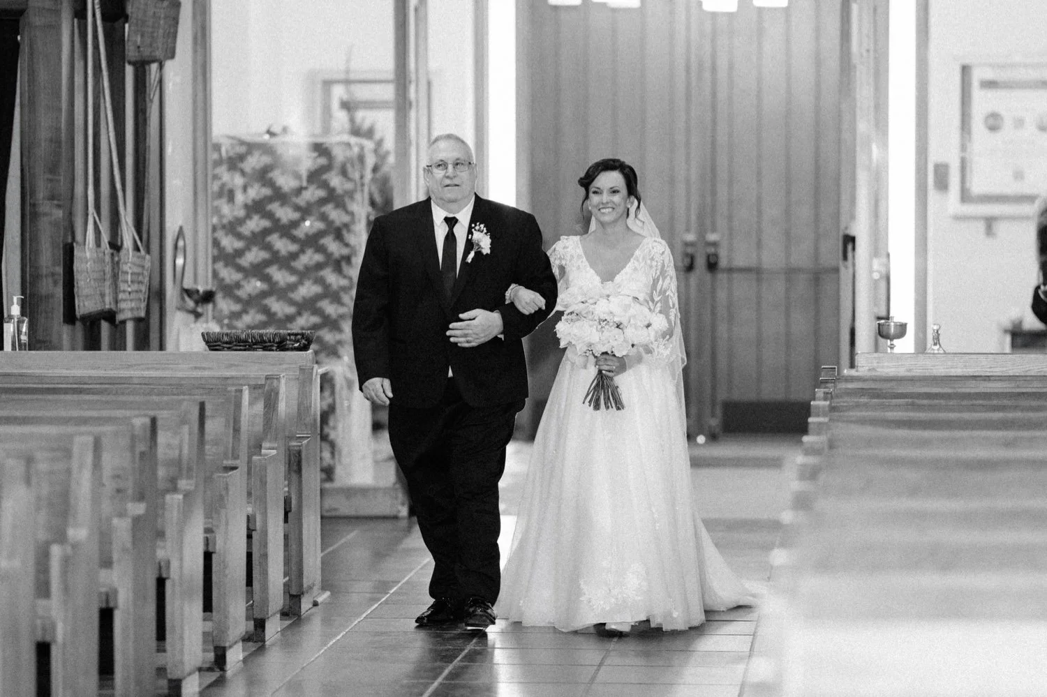  bride walking down the aisle with her father in newburgh, ny church 