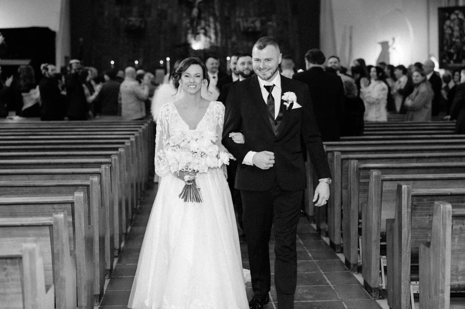  black and white wedding photograph of couple walking down church aisle in newburgh, ny 