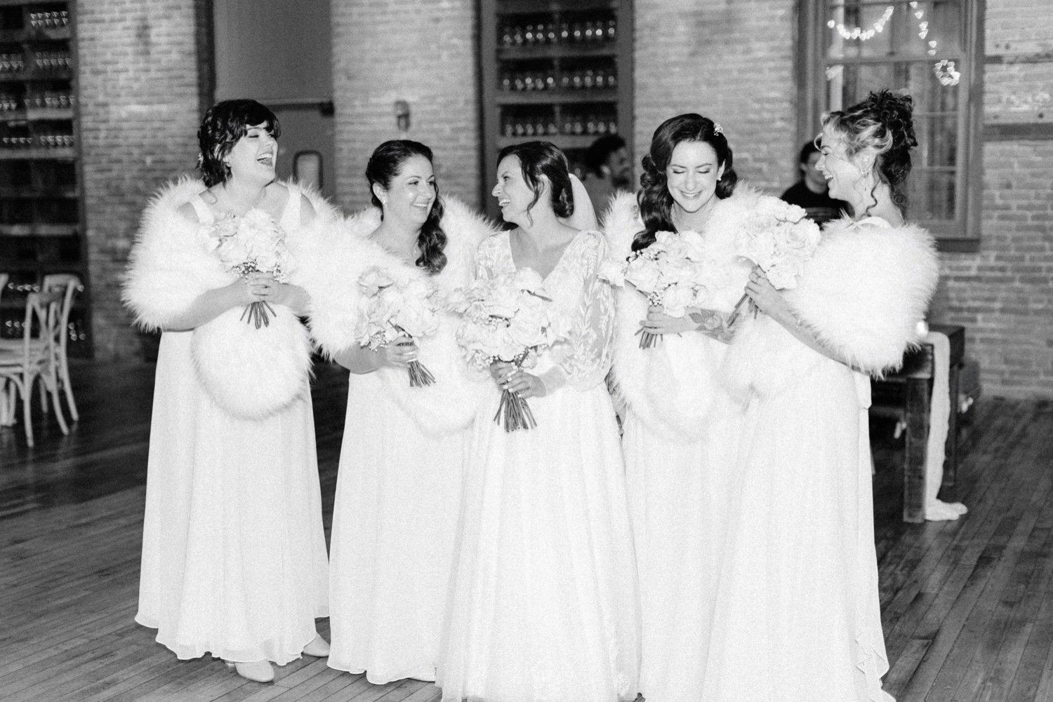  black and white photographs of bridemaids on winter wedding day inside city winery hudson valley  