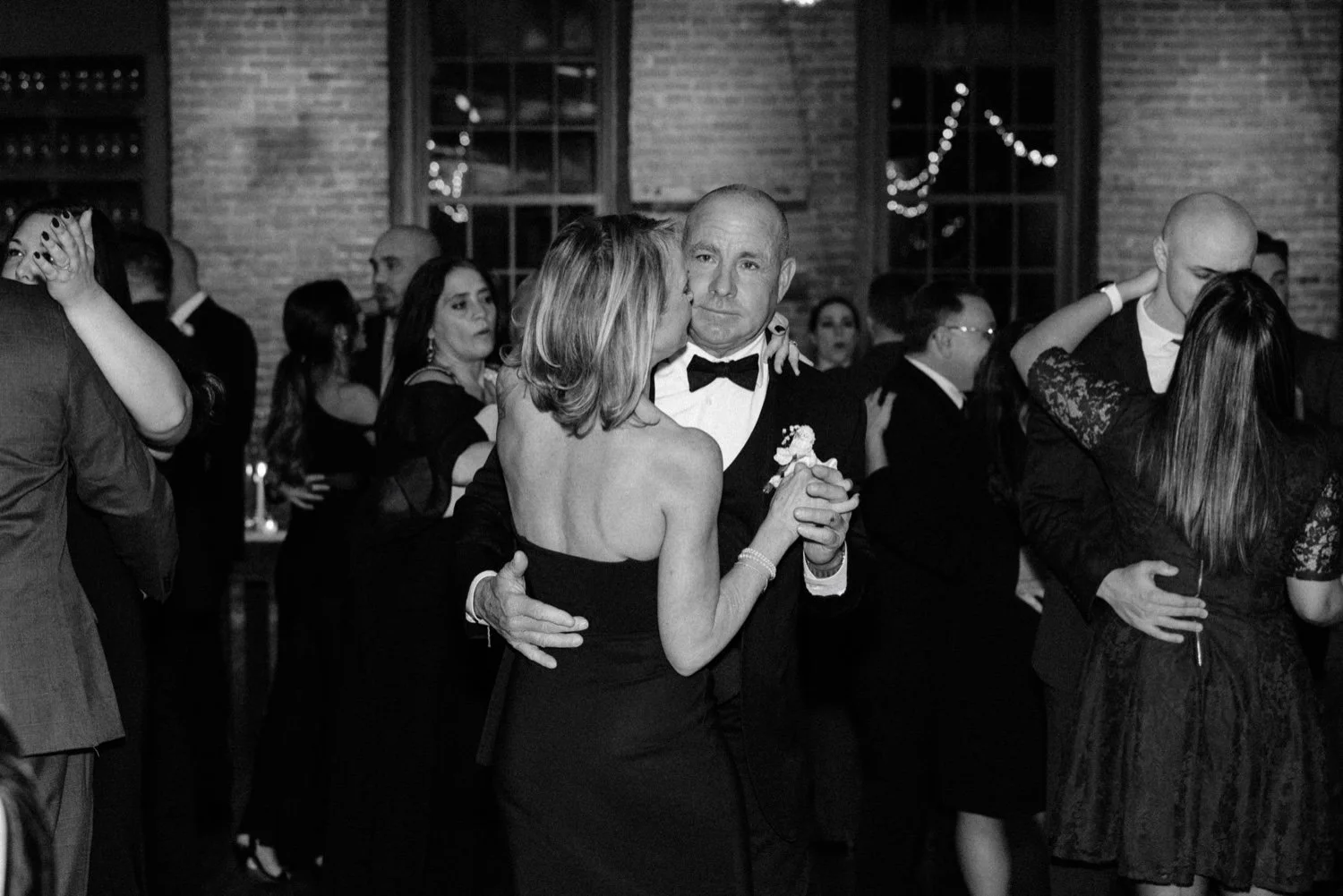  grooms parents dance during reception at winter wedding at city winery hudson valley 