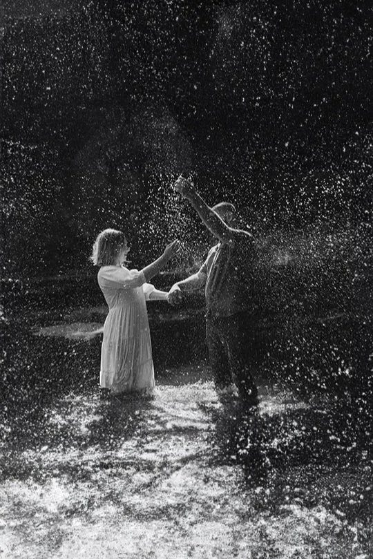 Couple play in water in Minnewaska State Park during their Hudson Valley engagement photo shoot with photographer Caitlinn Mahar-Daniels