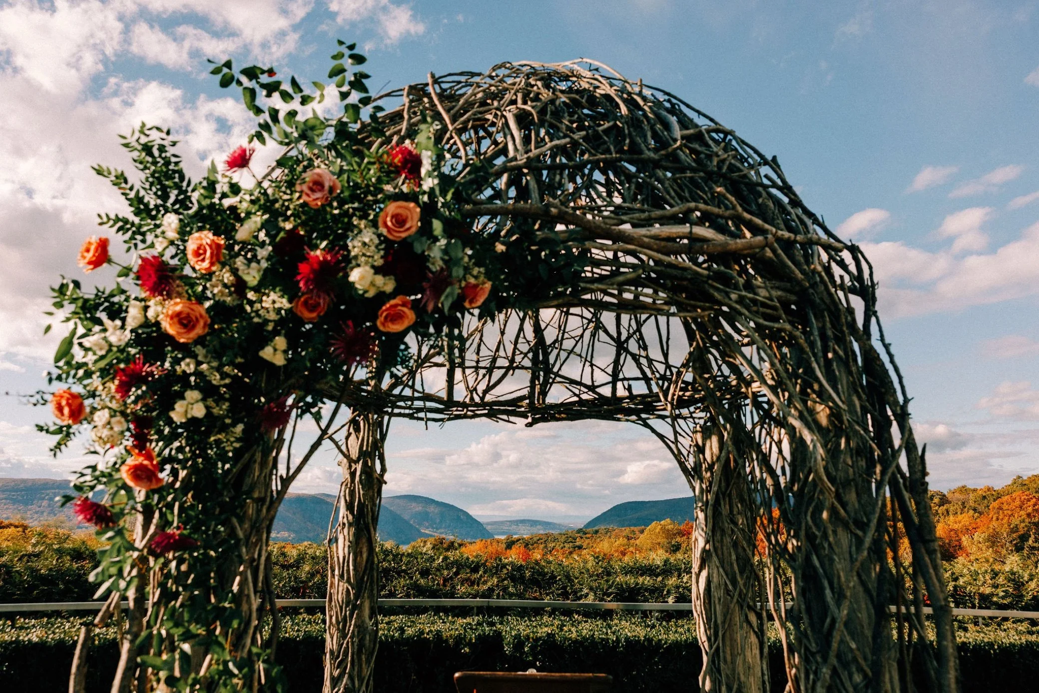  wedding ceremony arbor with florals at the garrison 