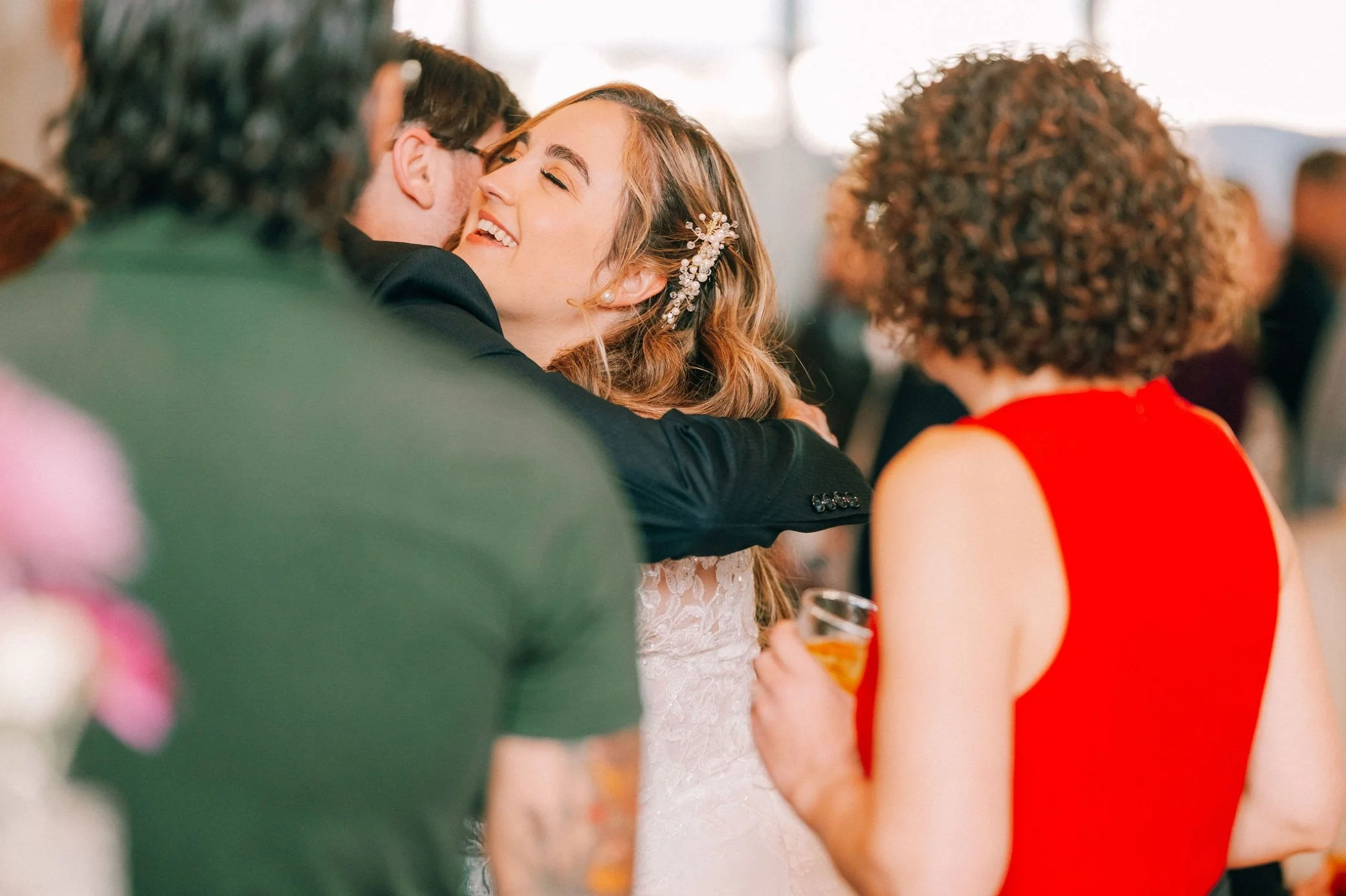  bride hugging guests at the garrison 