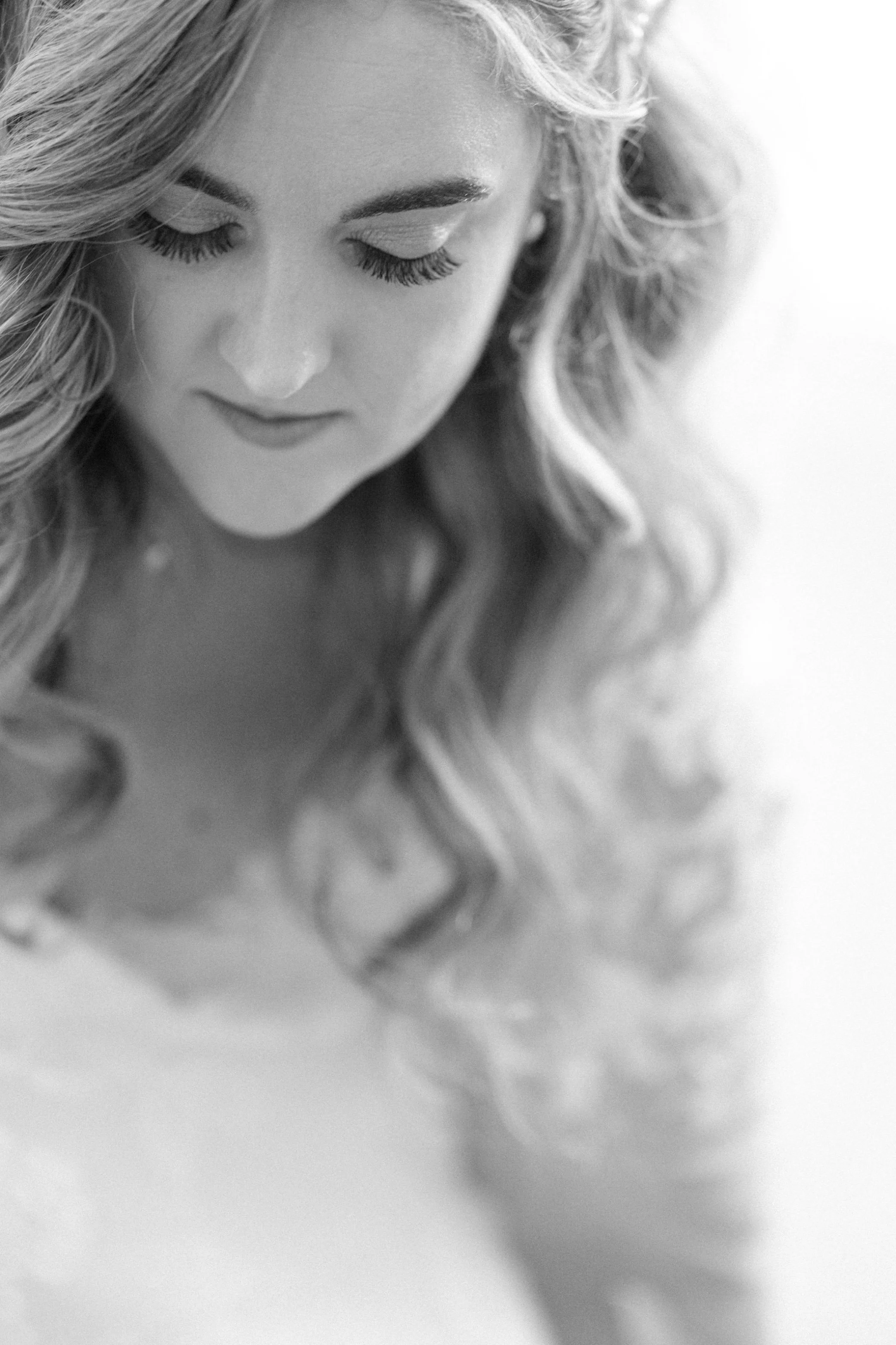  black and white wedding photographs of bride getting ready at the garrison 