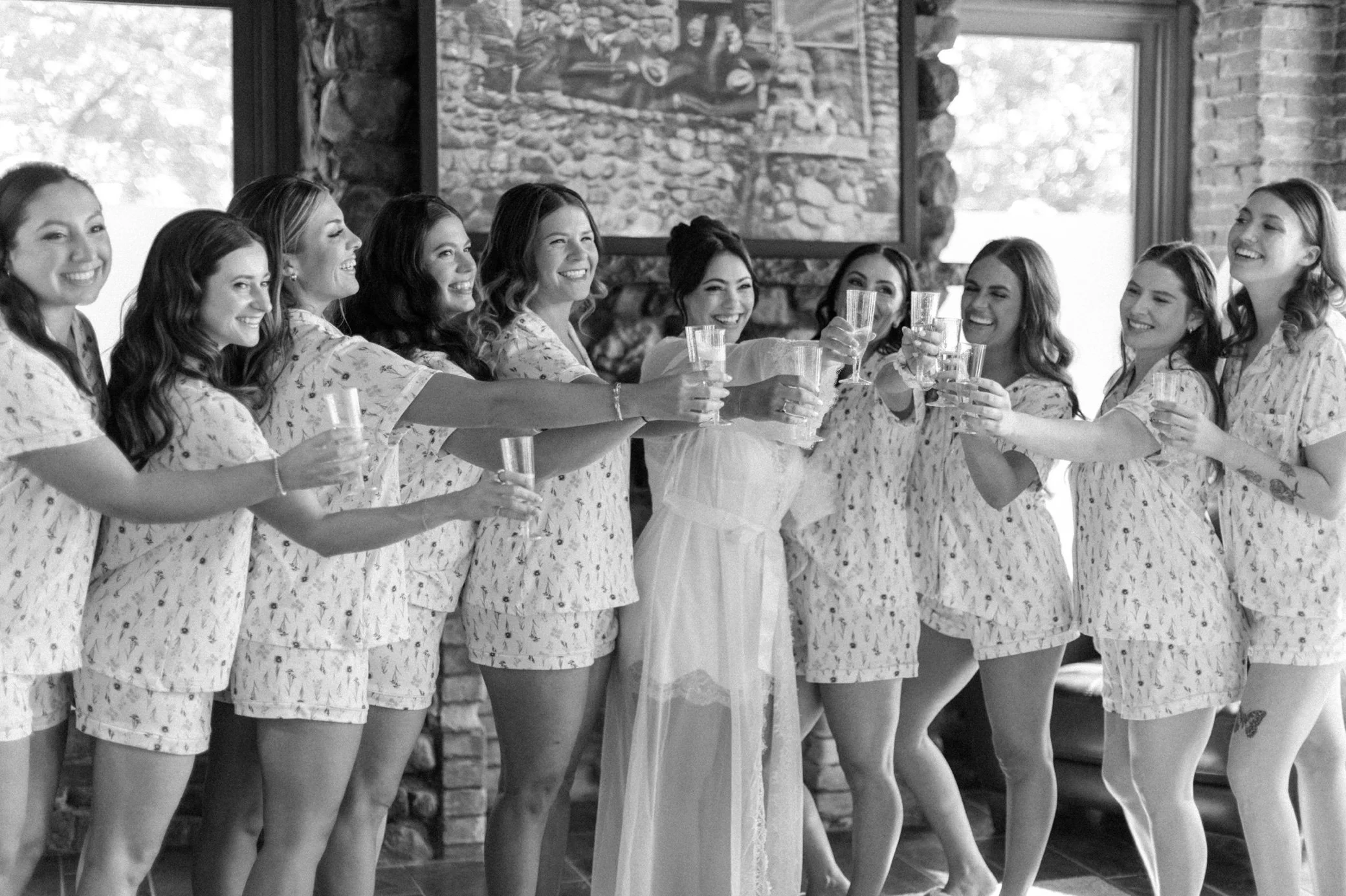  bridesmaids cheers in bridal suite at brotherhood winery 