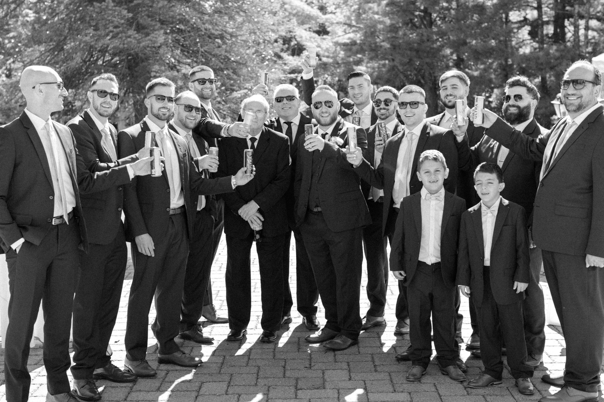  groomsmen with beer at brotherhood winery 