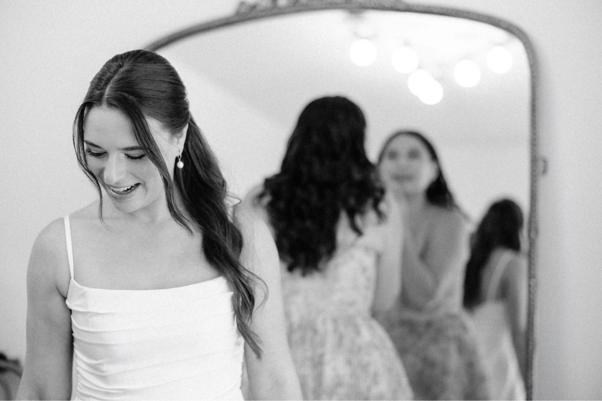  bride and sister getting ready on wedding day at gather greene 