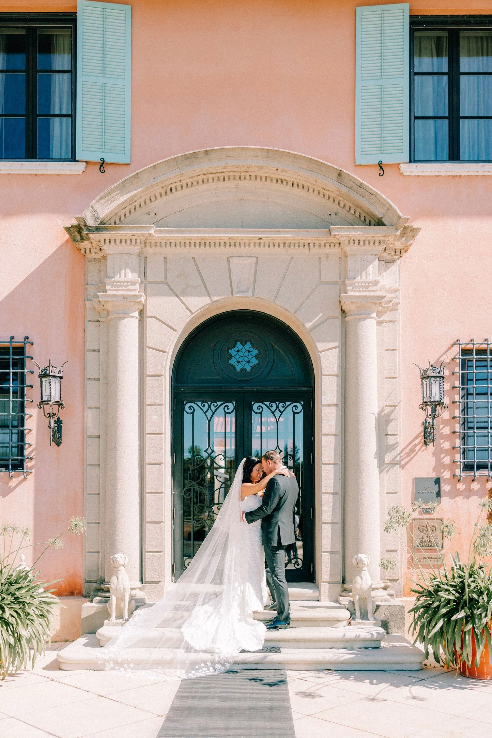  wedding couple at grand entrance of glenmere mansion 