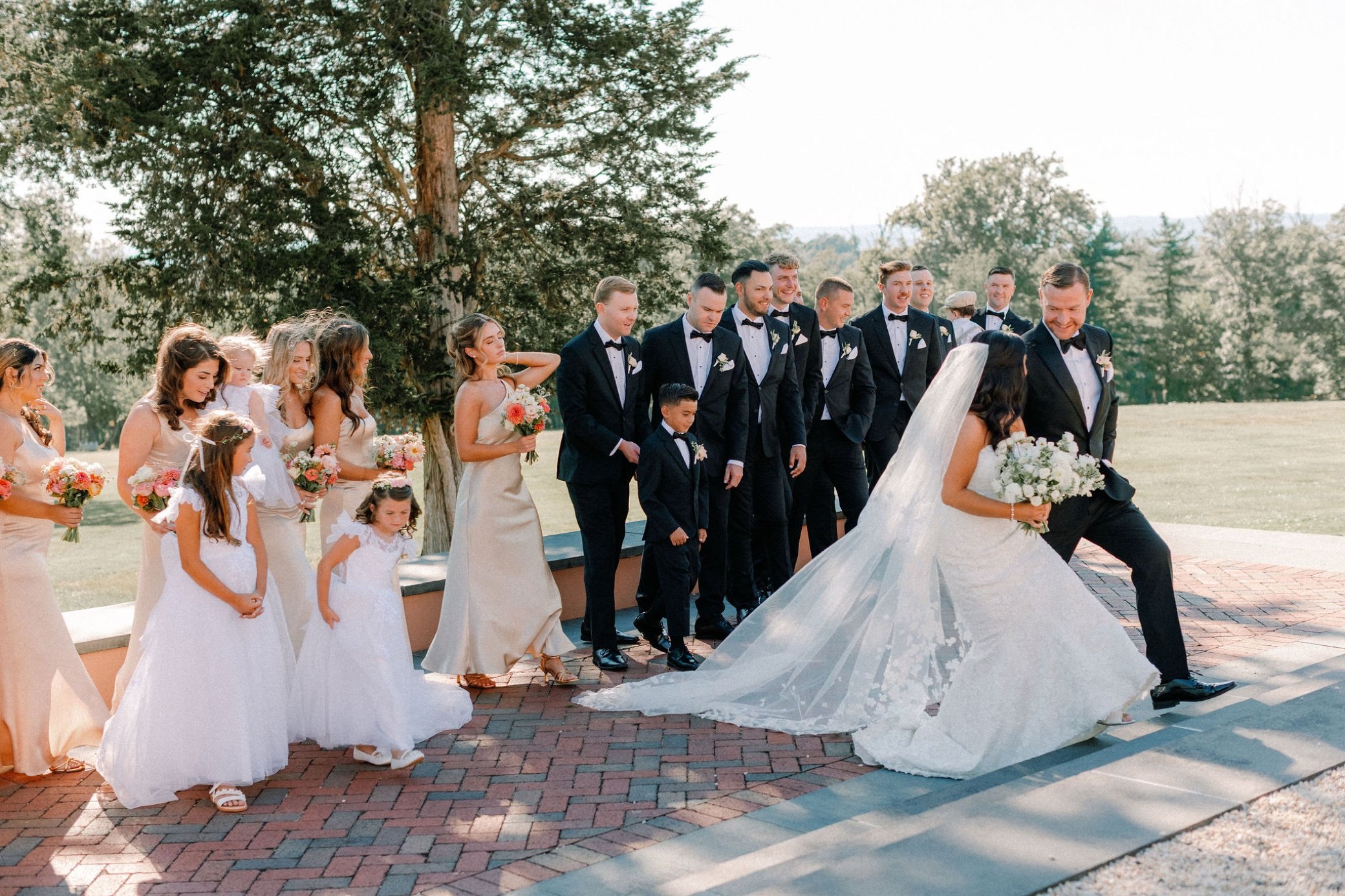  wedding party walking photograph at glenmere mansion 