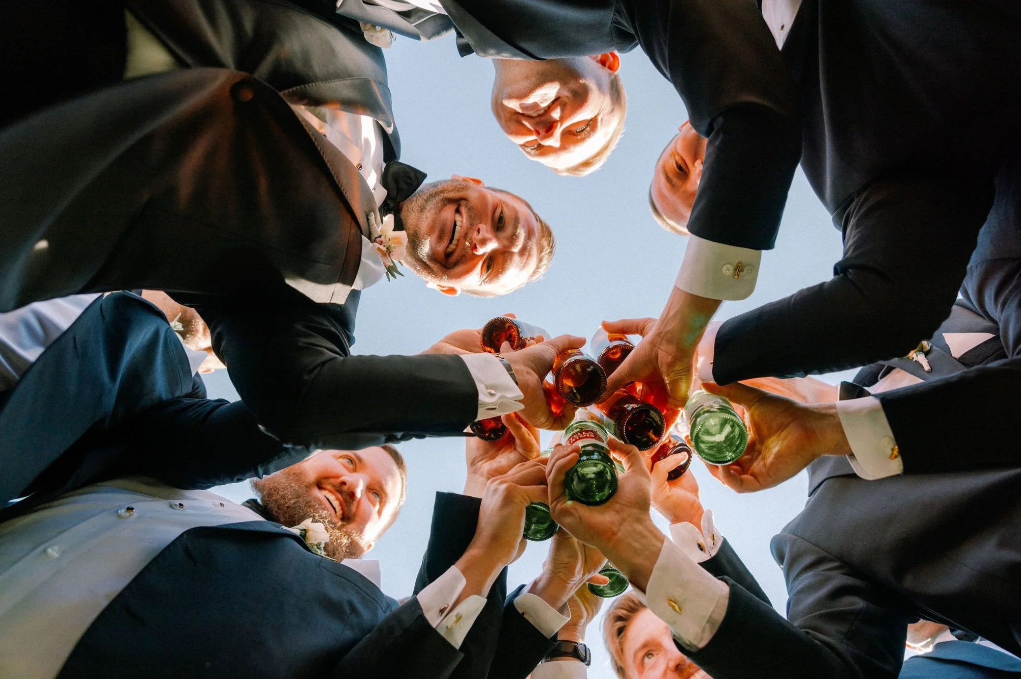  photograph of groomsmen cheersing drinks at glenmere mansion 