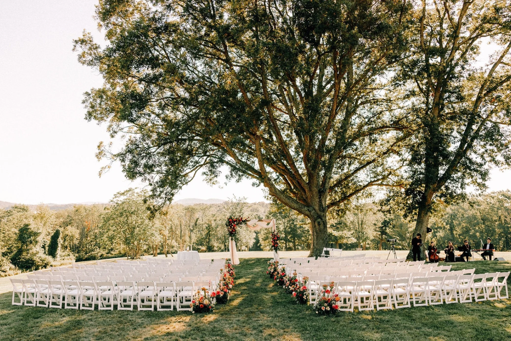  ceremony decor and seating on lawn of glenmere mansion 
