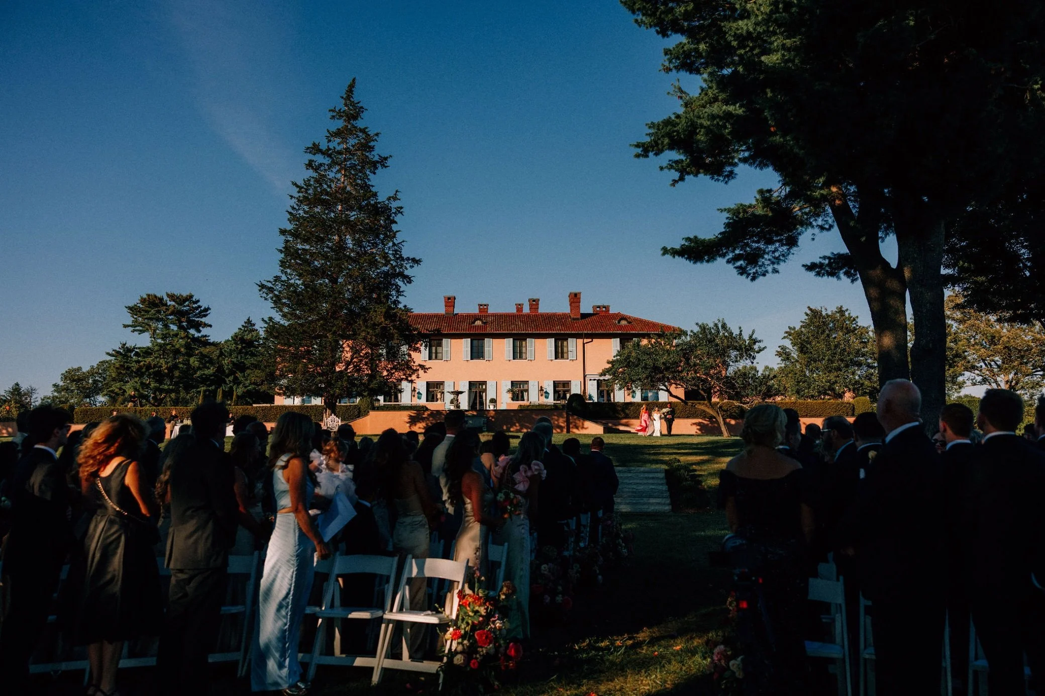  bride walking down stairs to outdoor ceremony at glenmere mansion 
