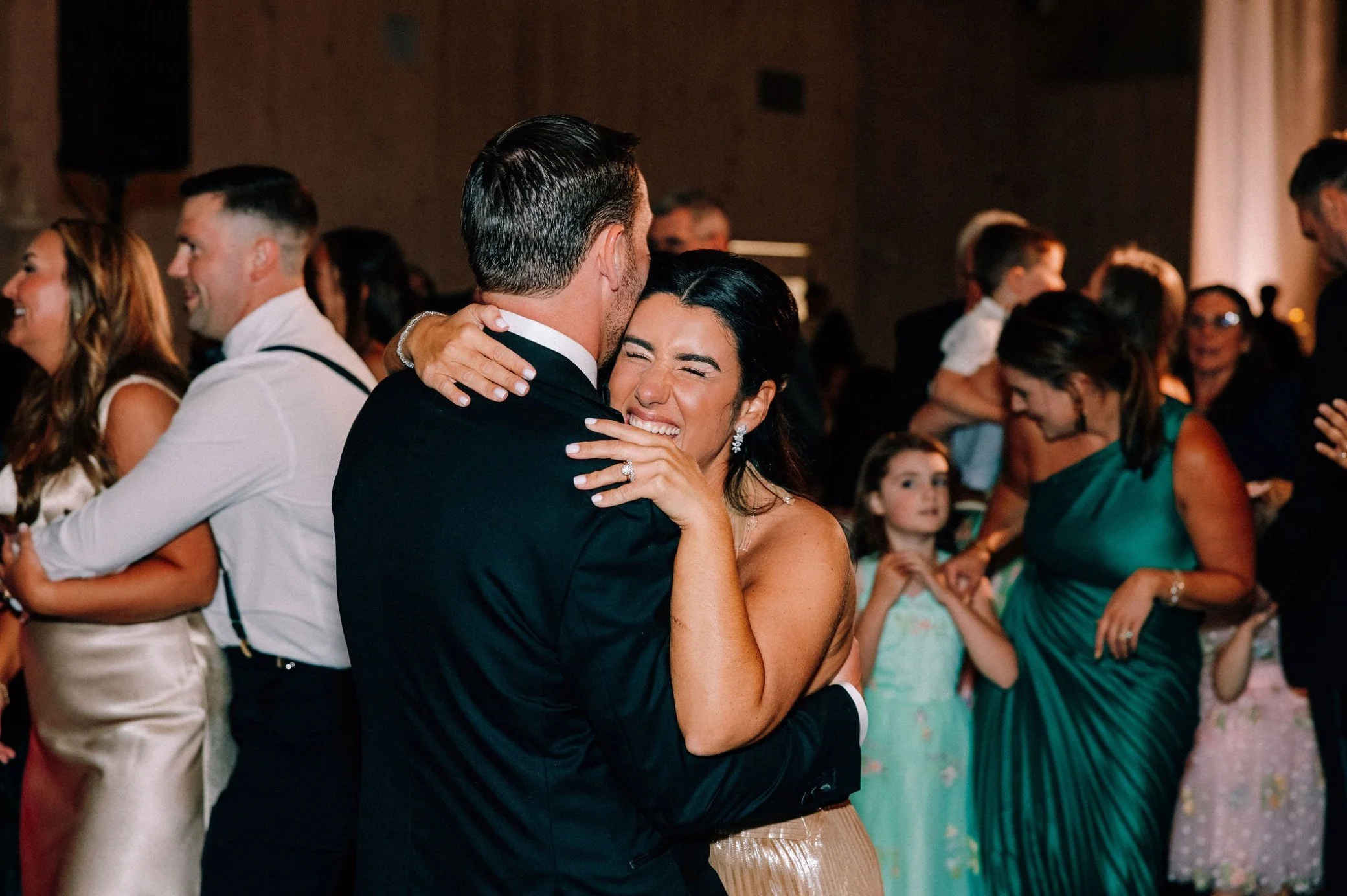  wedding couple hug during reception at glenmere mansion 