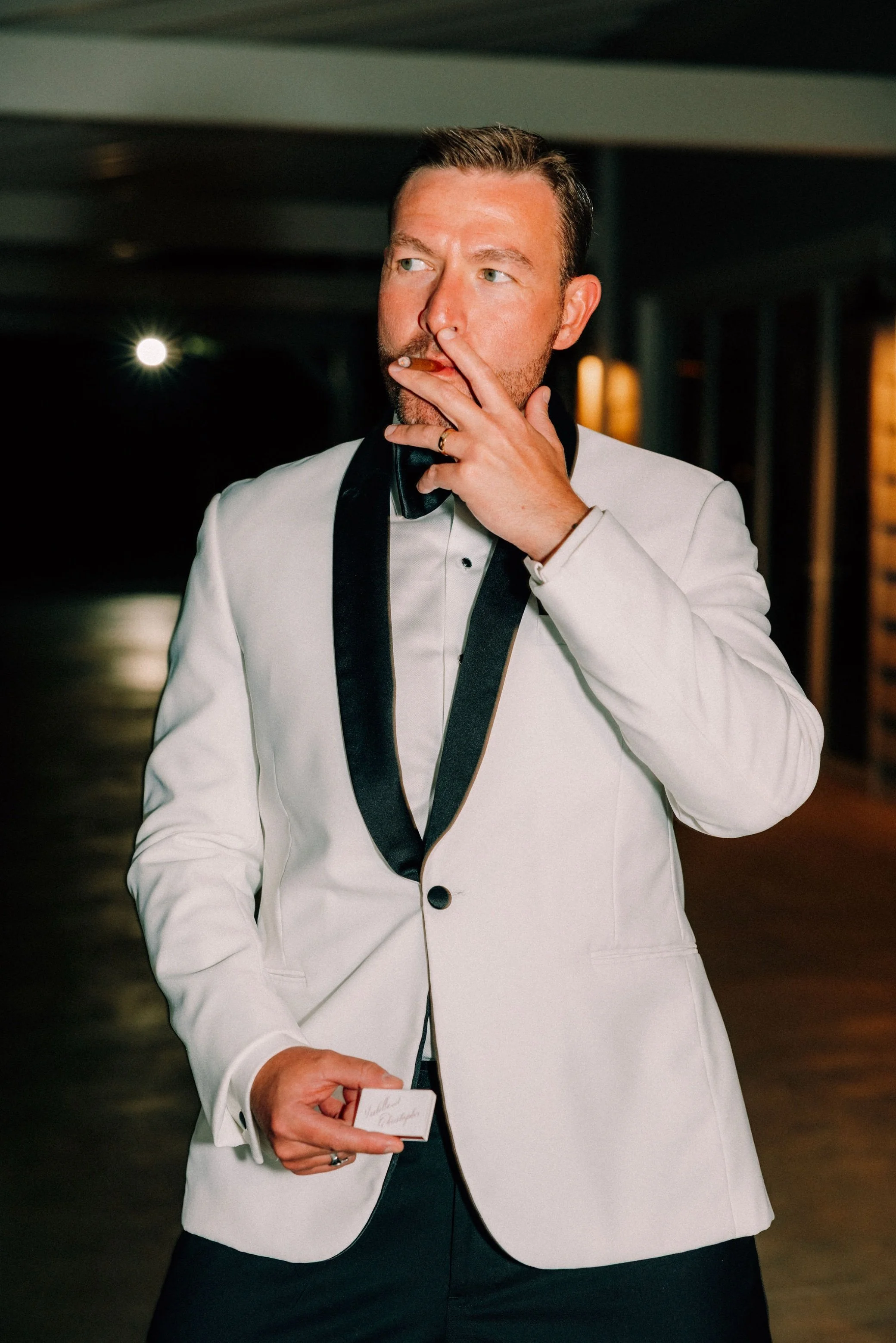  groom smokes cigar at glenmere mansion 