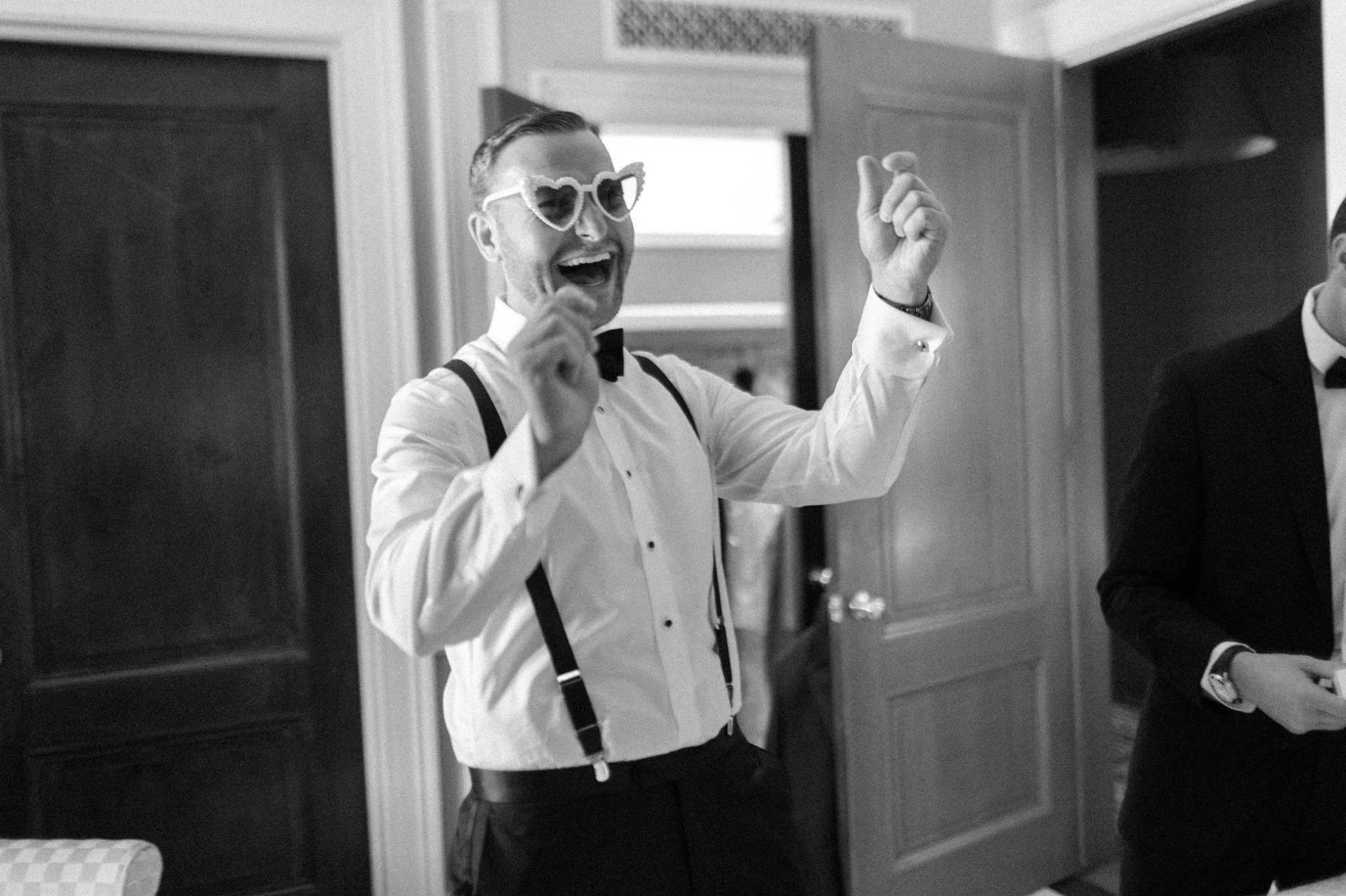  candid photograph of groom at glenmere mansion 